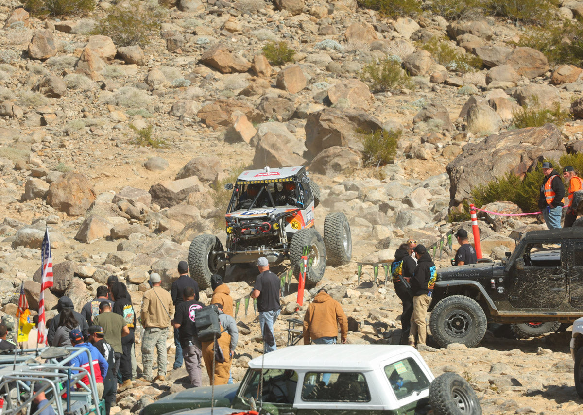 King of the Hammers ULTRA4 off-road racing event in the desert with fans watching the race