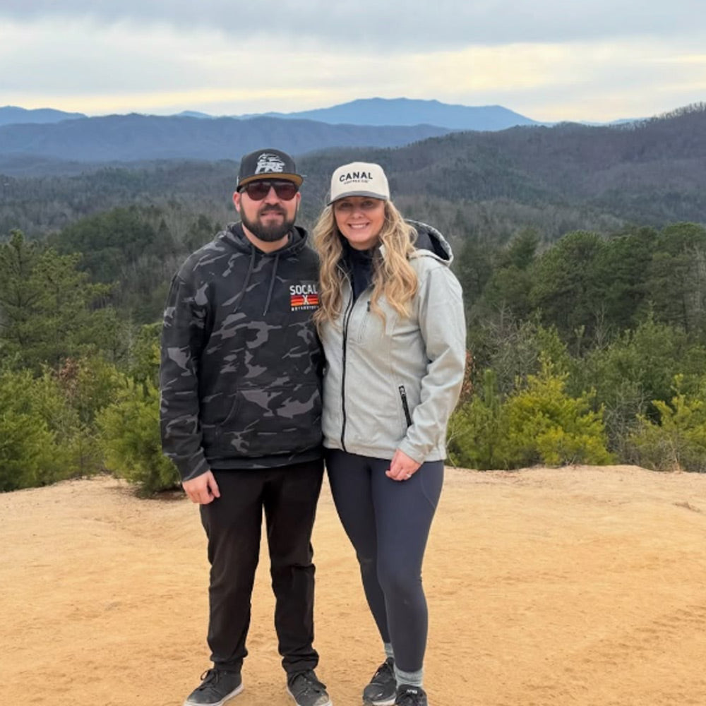 Socalx black camo hoodie worn by Spencer Boyd pro NASCAR truck series racer (with wife Amanda May)