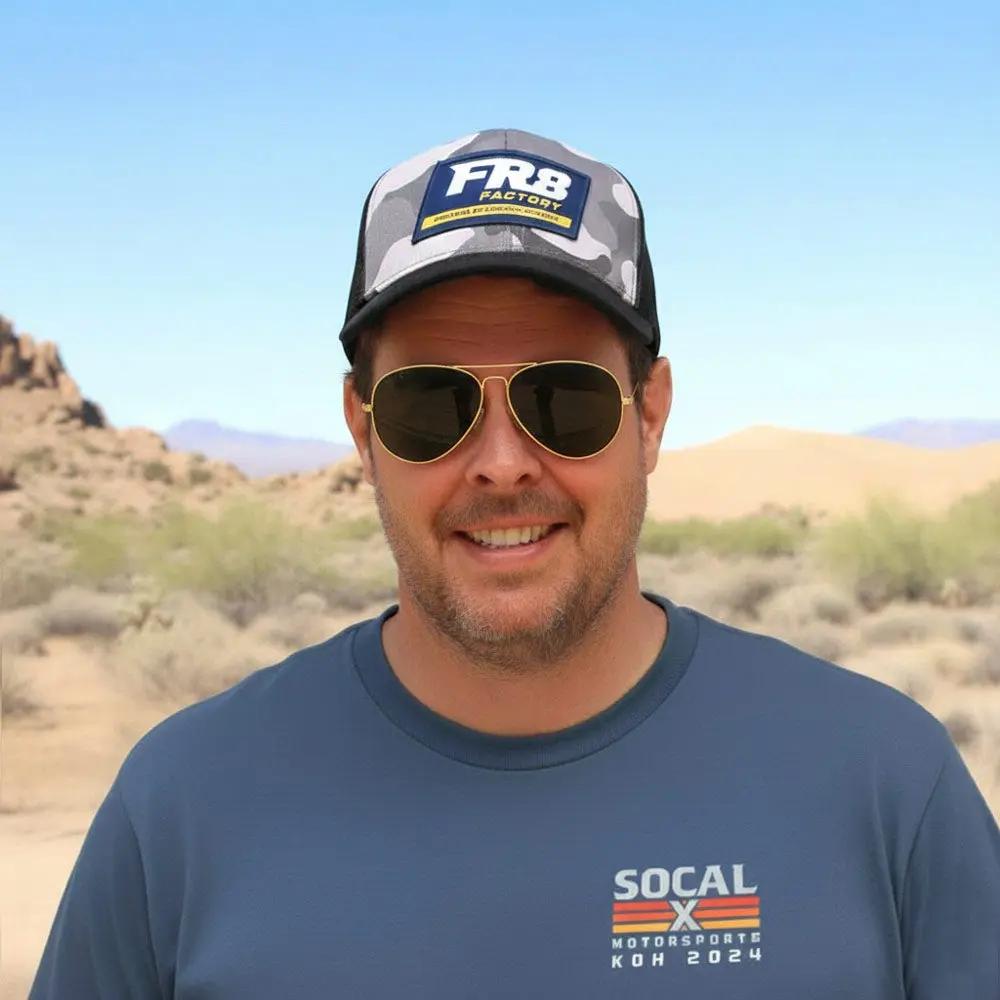Mac wearing a FR8 trucker hat and sunglasses with Blue Petrol Socalx t-shirt (KOH24 logo)