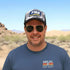 Mac wearing a FR8 trucker hat and sunglasses with Blue Petrol Socalx t-shirt (KOH24 logo)